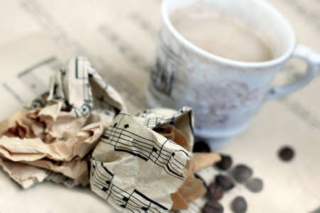 A white cup of coffee with steam and a musical note so closeの写真素材