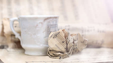 A white cup of coffee with steam and a musical note so closeの写真素材