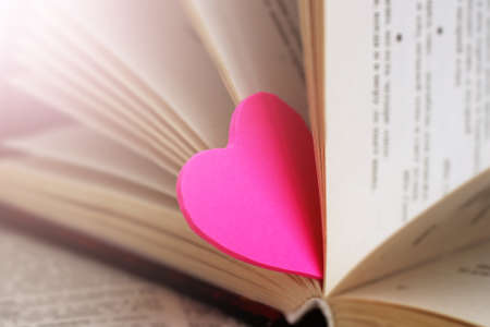Two pink hearts and books, love and romance imageの写真素材
