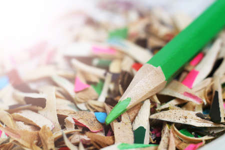 Colored pencils and book, wood chips objectの写真素材