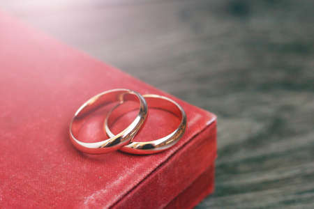 Golden rings on a velvet red box so closeの写真素材