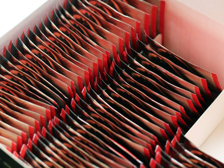 Lots of tea-bags arrange in box, red color