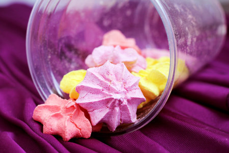 Pink and yellow meringues so close