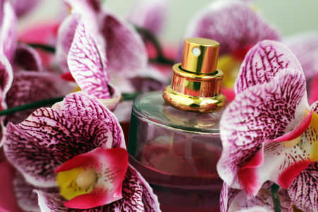 Pink orchid and perfume bottle, romantic gift