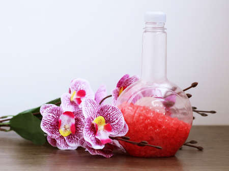 Color red sea salt and pink orchid, spa conceptの写真素材
