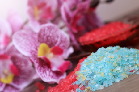 Color red sea salt and pink orchid, spa concept