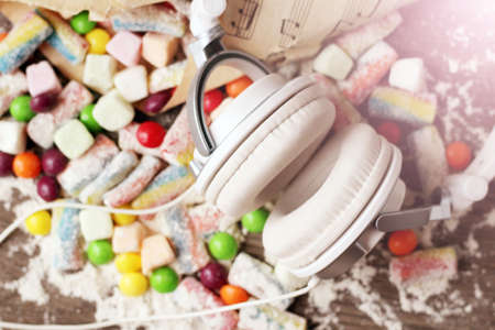 White headphones and delicious marmalade of different colors, musicの写真素材