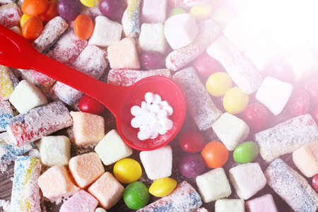 delicious marmalade of different colors and sugar substitute pills, sweet foodの写真素材