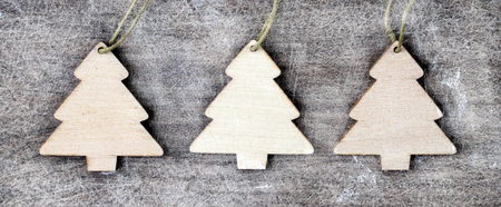 Three wooden Christmas trees, toys top viewの写真素材