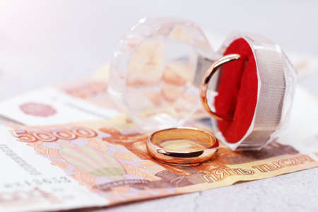 Wedding rings and russian money, married financeの写真素材