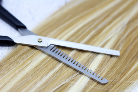 Milling scissors open and blonde hair so close