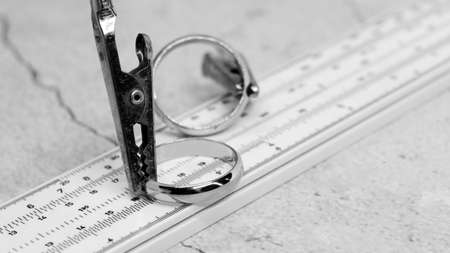 Golden rings and a measuring instrument, the value of jewelry, objectの写真素材