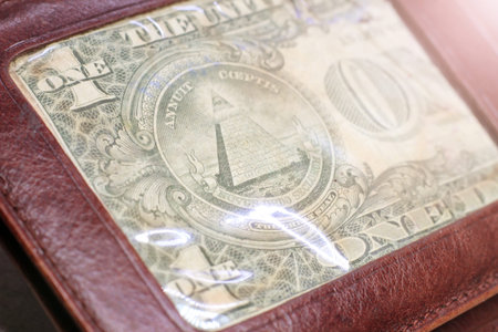 brown leather wallet with dollar so close, money