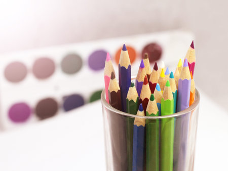 Set of color pencil in a glass bottle so closeの写真素材