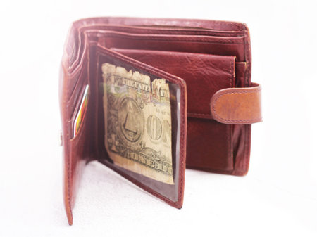 leather wallet with one dollar bills so close