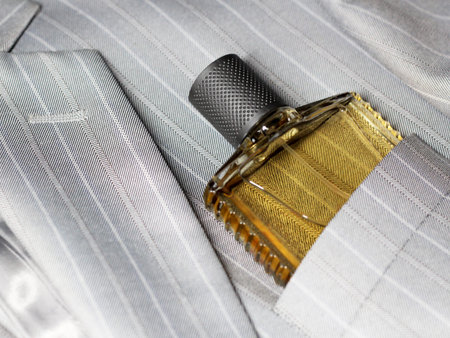 Men's perfume in the pocket of a man's jacket, fashion