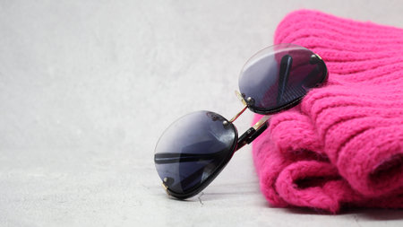 Women's sunglasses and a bright pink scarf, fashionの写真素材