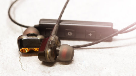 Macro close up of black earphones, music objectの写真素材
