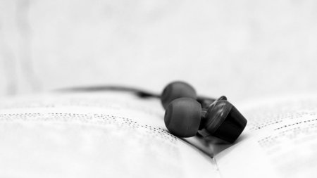 Macro close up of black earphones, music object