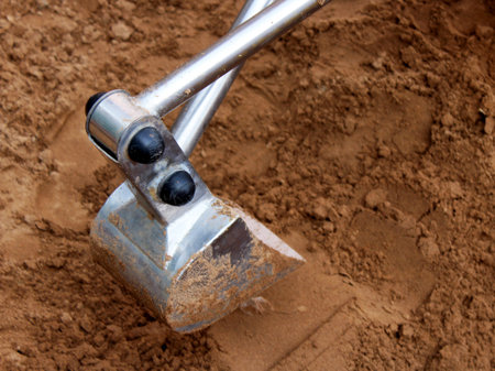 Excavator Bucket and a sand so close