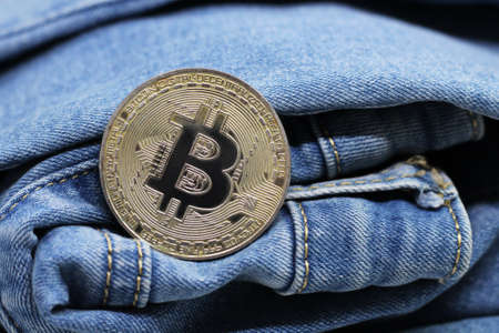 Gold Bitcoin on Jeansの写真素材