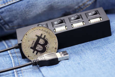 Gold Bitcoin on Jeansの写真素材