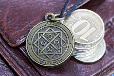 Old Money talisman and russian coins so close, retro magic objectの写真素材
