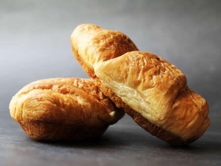 Delicious fresh croissants on a black background, foodの写真素材