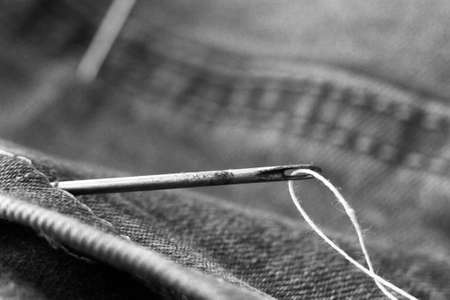 Needle for sewing and jeans so closeの写真素材
