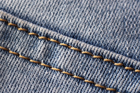 Blue jeans with seam closeup shot. Fashion.