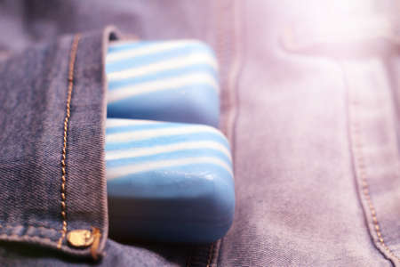 Blue soap in a pocket of jeans. Blue soap in the pocket of jeans.の写真素材