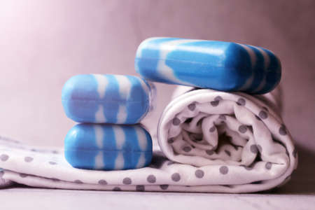 Blue soap bars and a towel on a light background, close-upの写真素材
