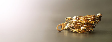 Gold chain with clasp on black background
