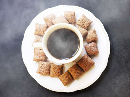 Cup of coffee and chocolate pads snacks, healthy breakfastの写真素材