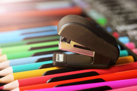 Stapler and color pencils, closeup. School suppliesの写真素材