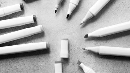 Many different pens on grey background, flat lay. Space for textの写真素材