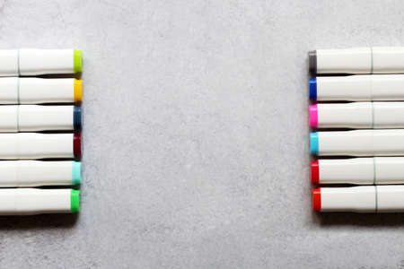Colorful markers on a gray background. Top view with copy space.の写真素材