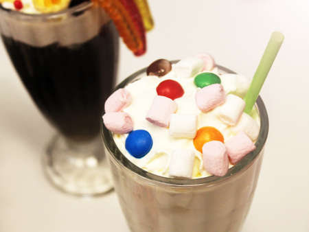 Milkshake with cream and colored marmalade for childrenの写真素材