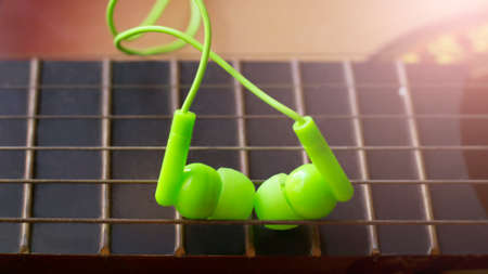 Green Vacuum Headphones and Guitar Stringsの写真素材