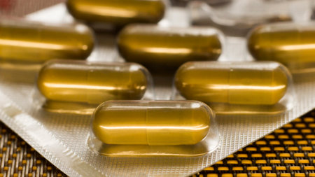 Capsules of fish oil, omega 3 and vitamin D.の写真素材