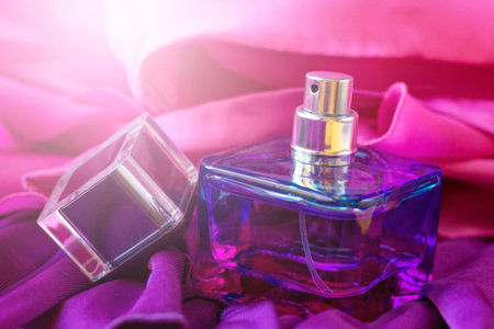 Women's pink-lilac perfume on a lilac dress