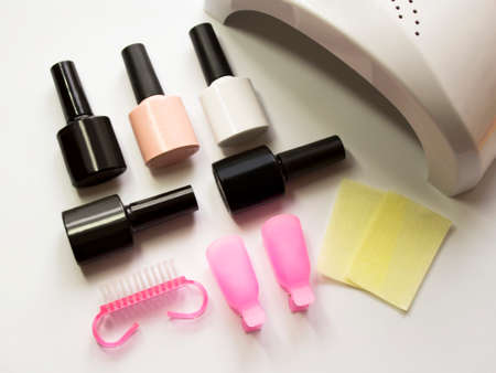 Manicure set. Gel varnishes, UV lamp. Beauty salon.の写真素材
