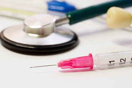 Syringe with needle and stethoscope, vaccination