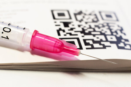 QR code and syringe on a white background close-up
