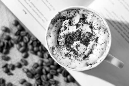 Coffee cup and coffee beans, black and white photo.の写真素材