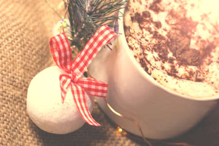 Cup of coffee with christmas decoration on rustic background.の写真素材