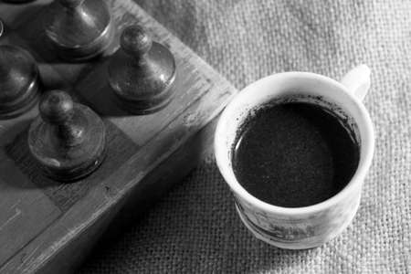 Cup of coffee and vintage wooden chess, retroの写真素材