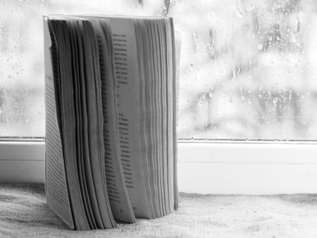 Stack of magazines on window sill, closeup. Space for textの写真素材