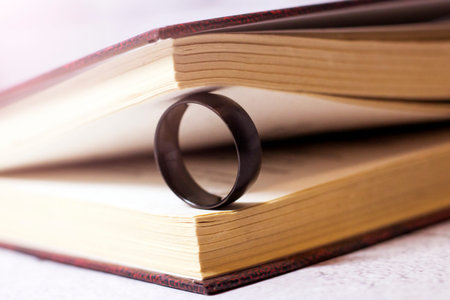 Black ring and open book, macro
