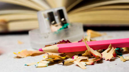 Pencil sharpener and colored shavingsの写真素材